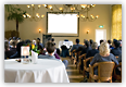 Group of people sitting in conference room Group of people sitting in conference room
